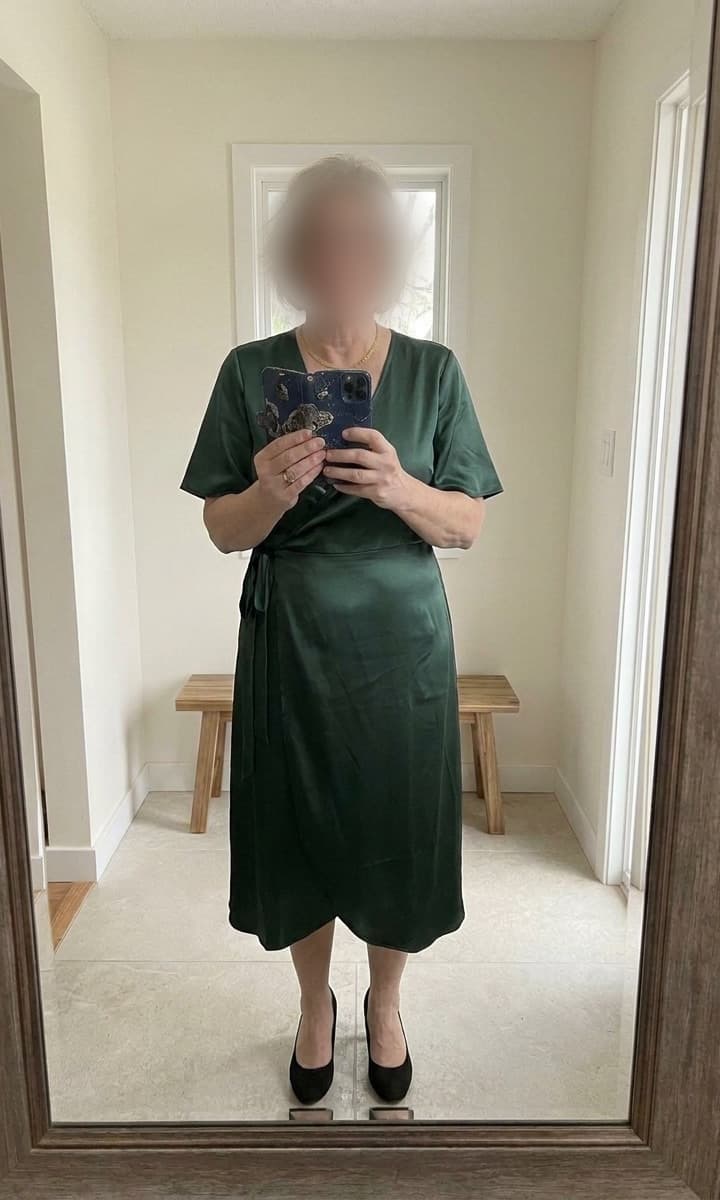Ana after, in a green dress